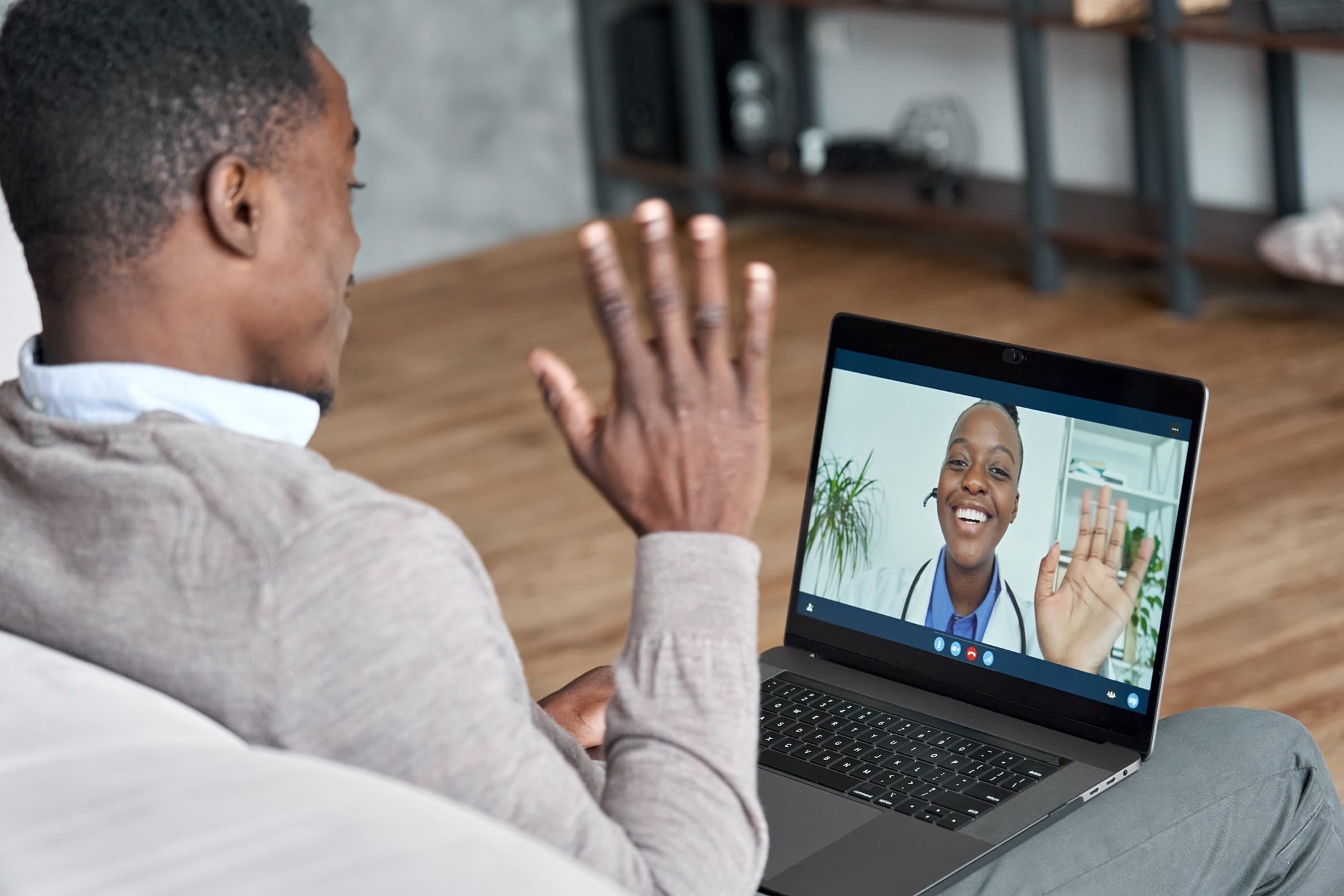 Male black patient talking on conference video call to female african doctor. Virtual therapist consulting young man during online appointment on laptop at home. Telemedicine chat, telehealth meeting | TMZ Behavioral Care in Davie, FL