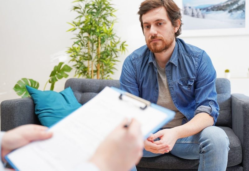 Psychologist doctor taking notes during psychotherapy session | TMZ Behavioral Care in Davie, FL
